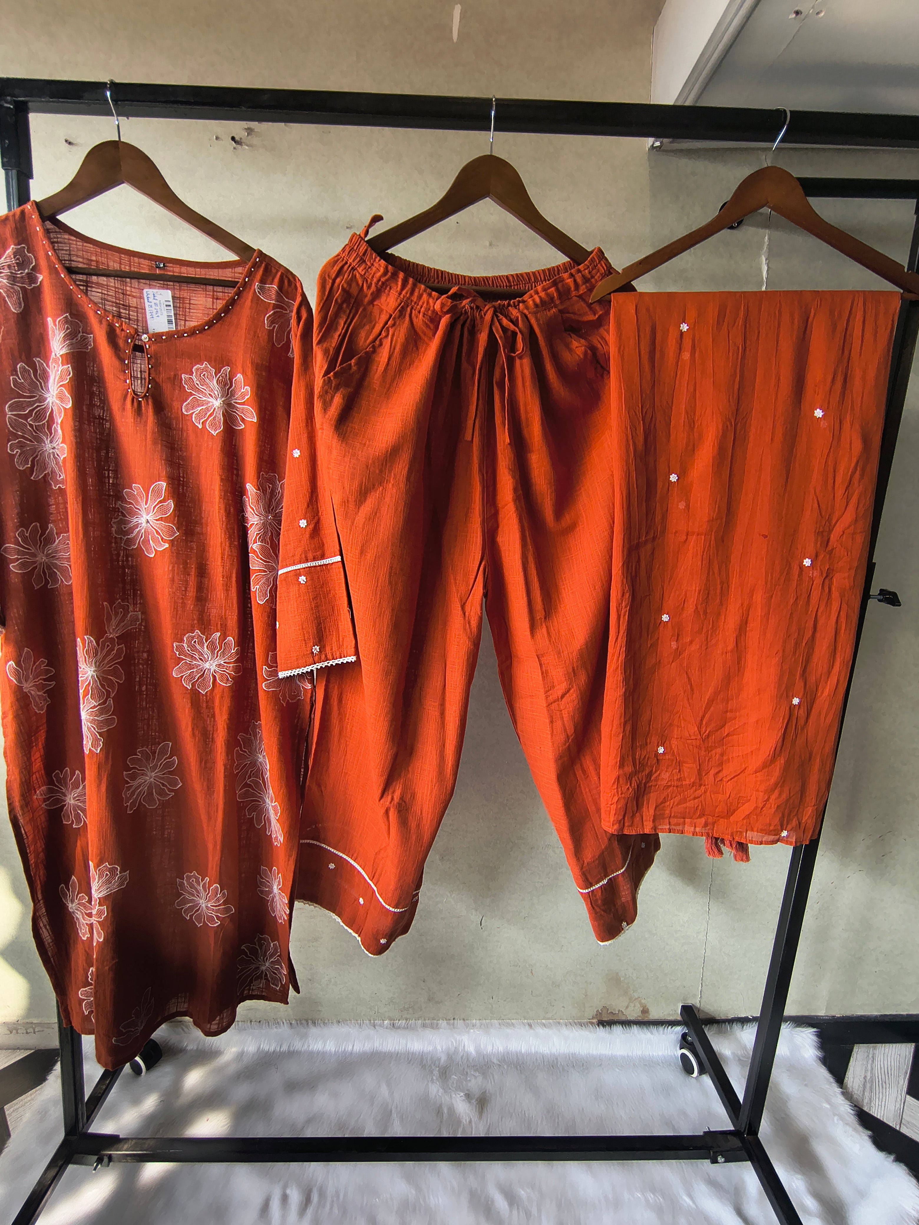 Image of Rust Orange Floral Printed Cotton Kurta Set with Solid Pants & Embroidered Dupatta