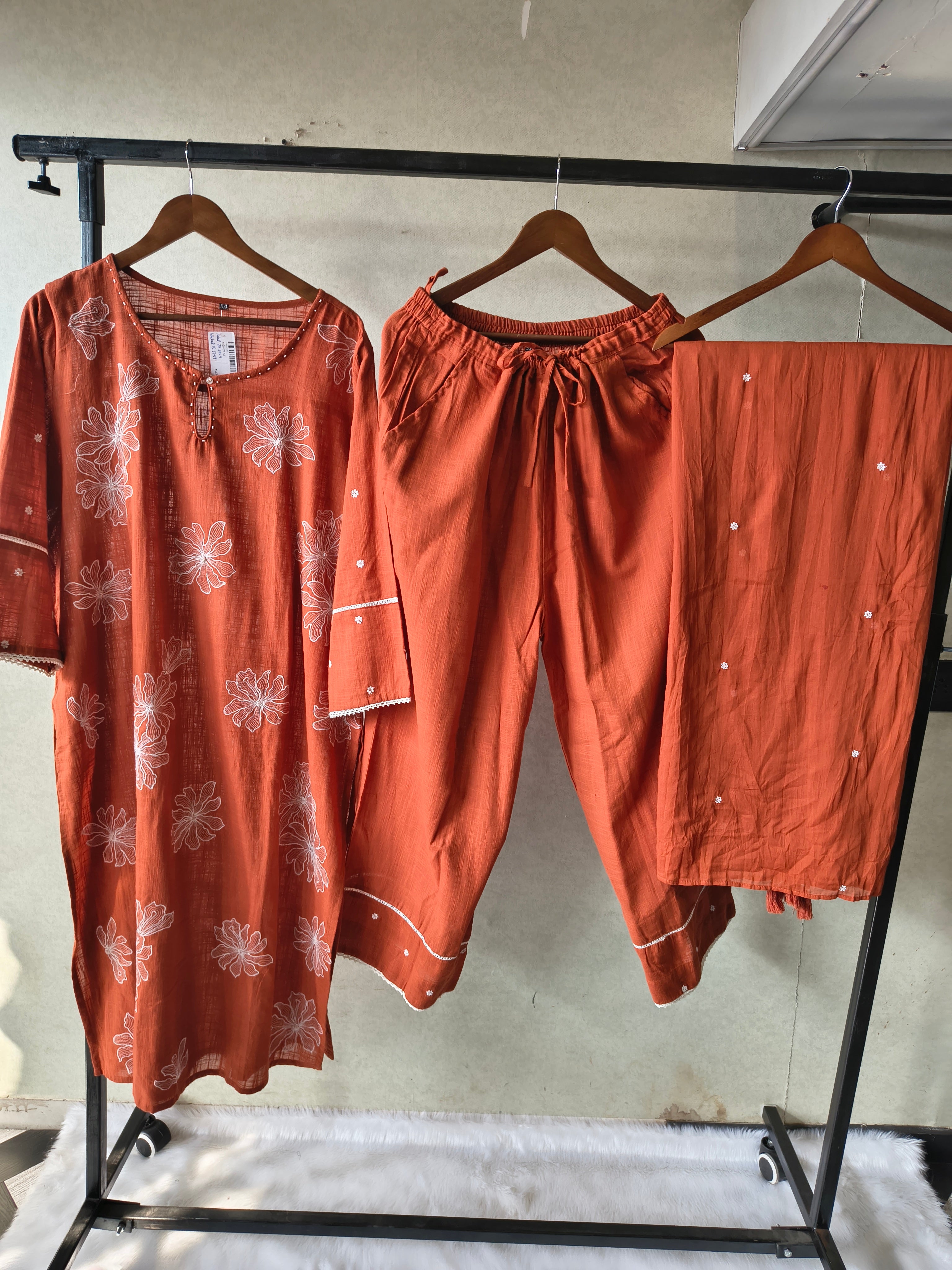 Image of Rust Orange Floral Printed Cotton Kurta Set with Solid Pants & Embroidered Dupatta