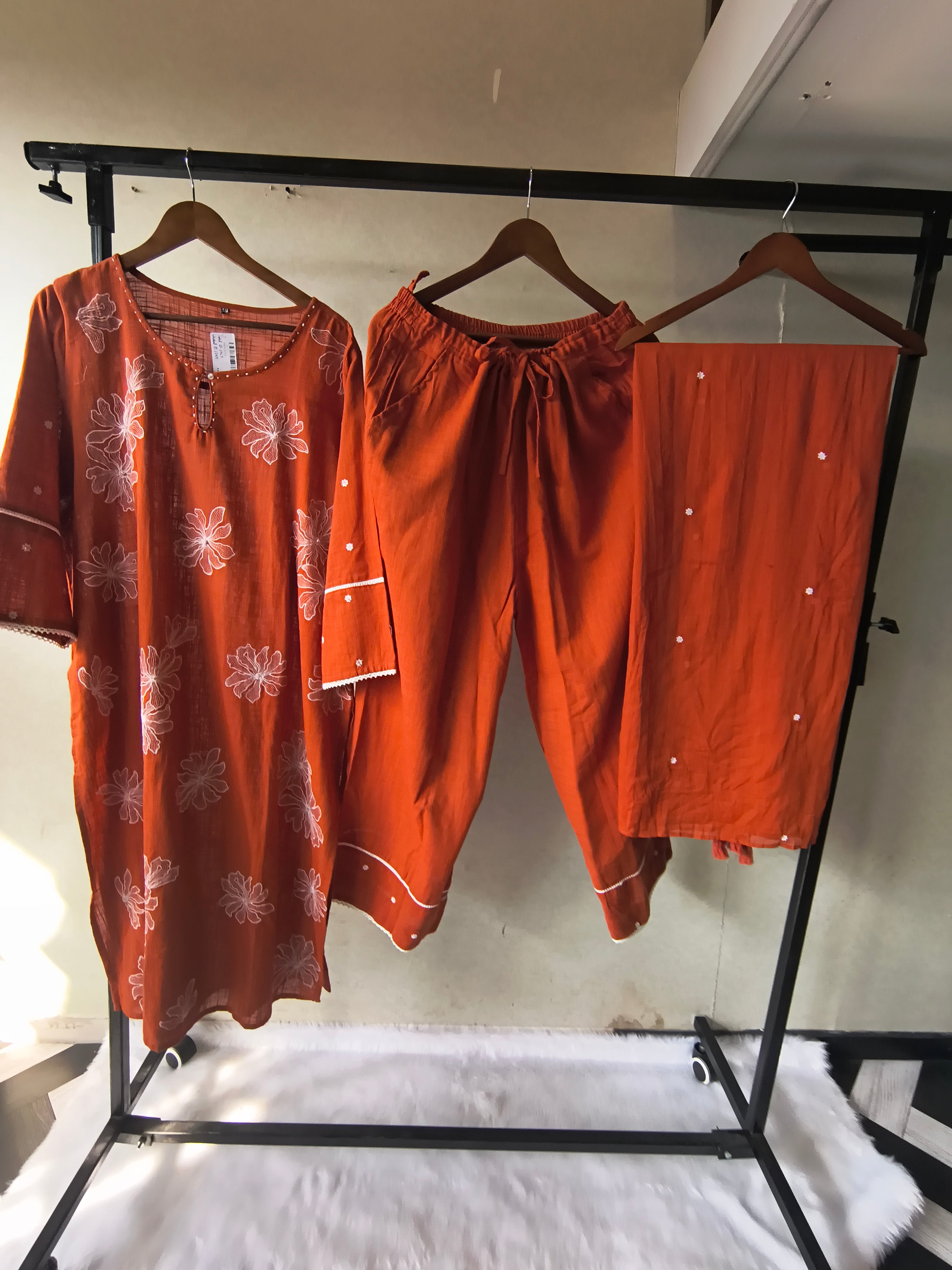 Image of Rust Orange Floral Printed Cotton Kurta Set with Solid Pants & Embroidered Dupatta