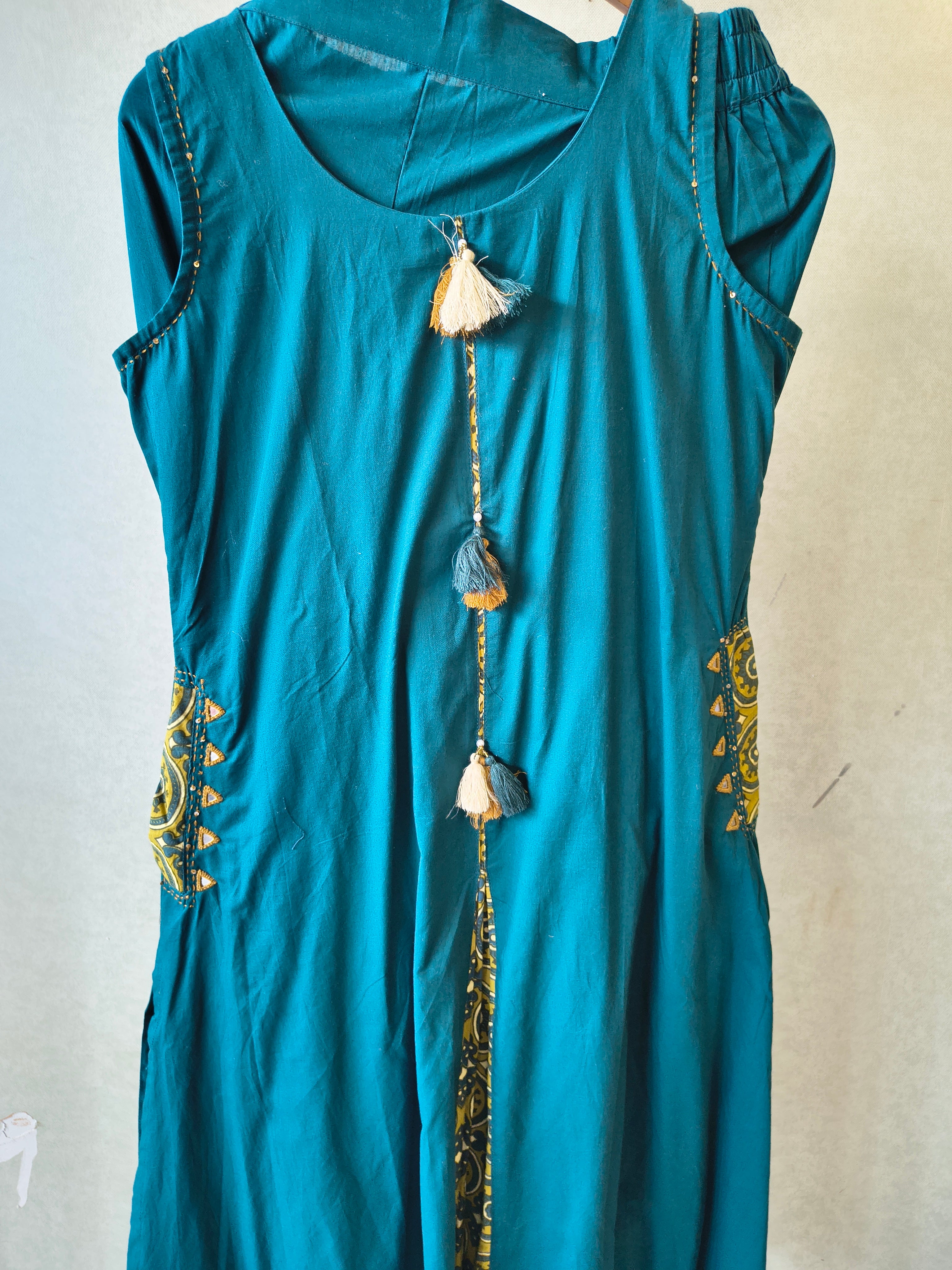 Image of Teal Sleeveless A-Line Kurta Set with Printed Panel & Straight Pants