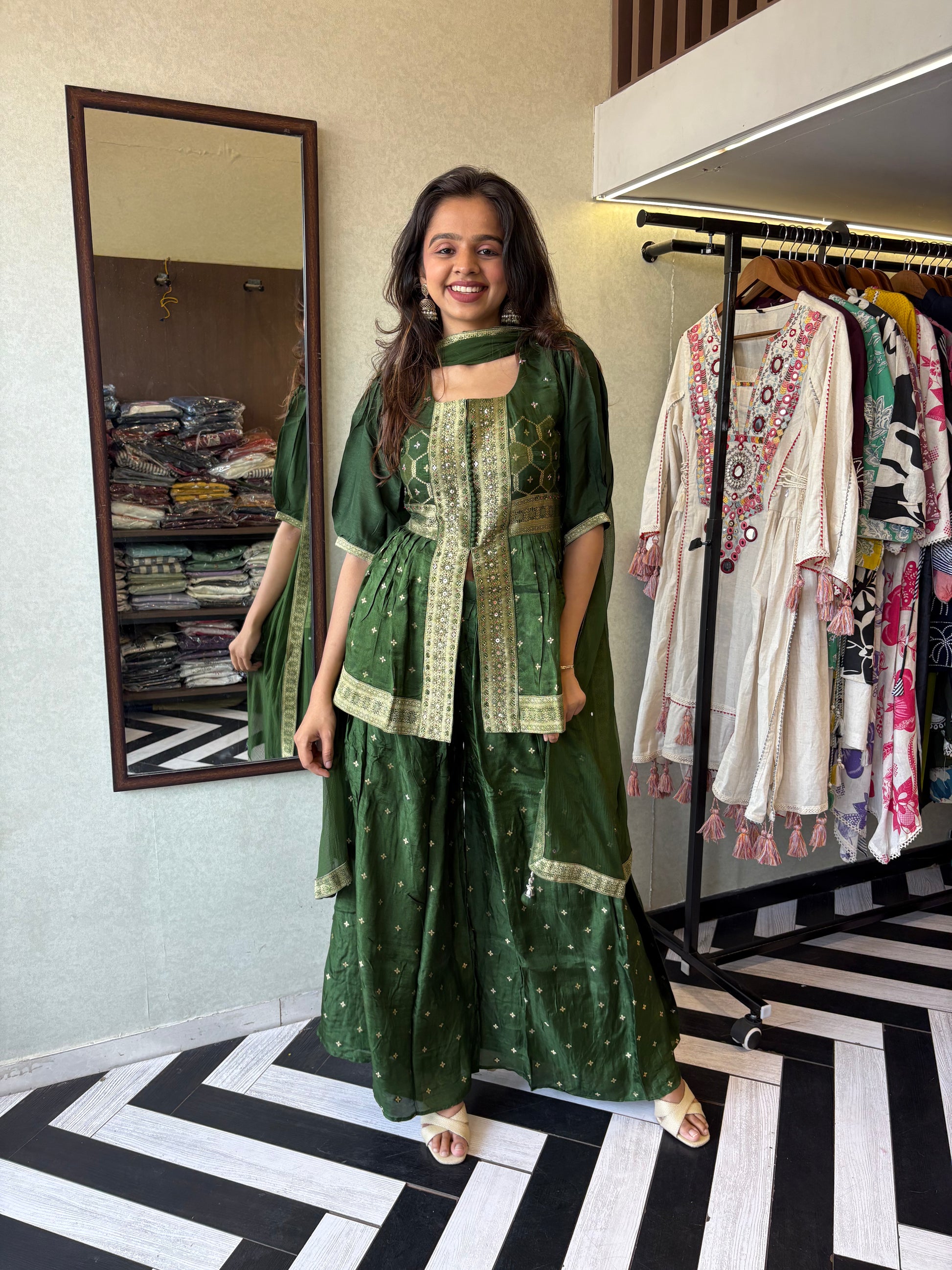 our premium pure silk 3-piece Indo-Western set in stunning green! From dazzling mirror & handwork on the jacket-style top to the flowing plazzo and dupatta