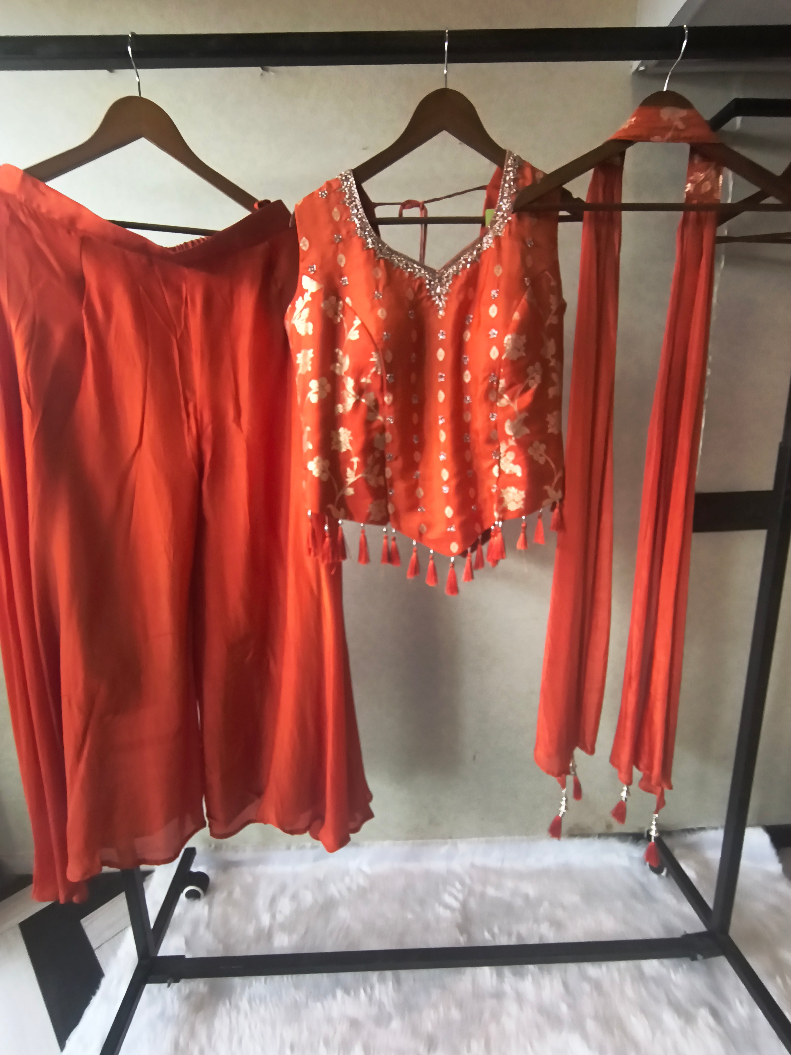 Image of Premium Rust Orange 3-Piece Designer Lehenga Set with Zari Embroidered Peplum Blouse & Tassel Dupatta