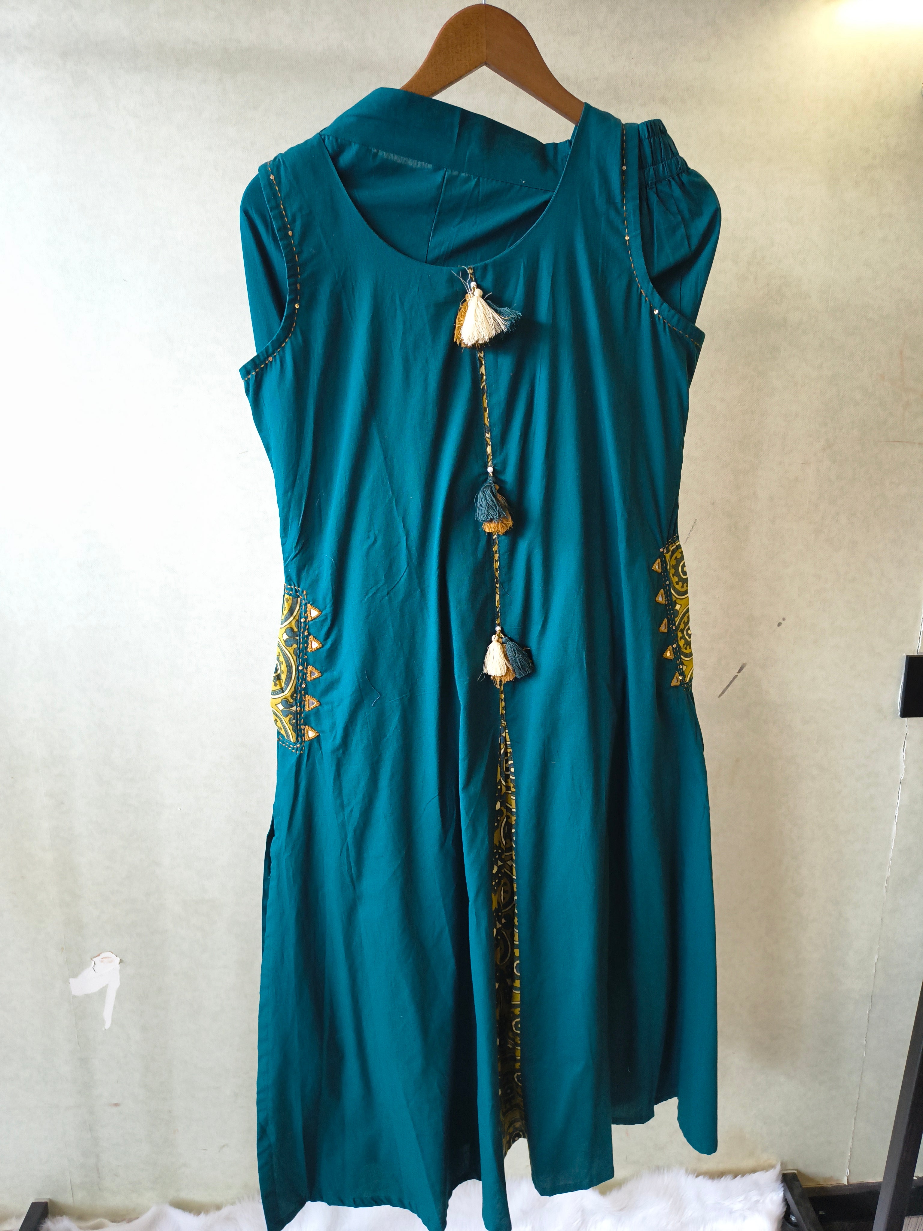 Image of Teal Sleeveless A-Line Kurta Set with Printed Panel & Straight Pants